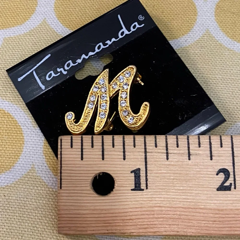 N/A gold initial